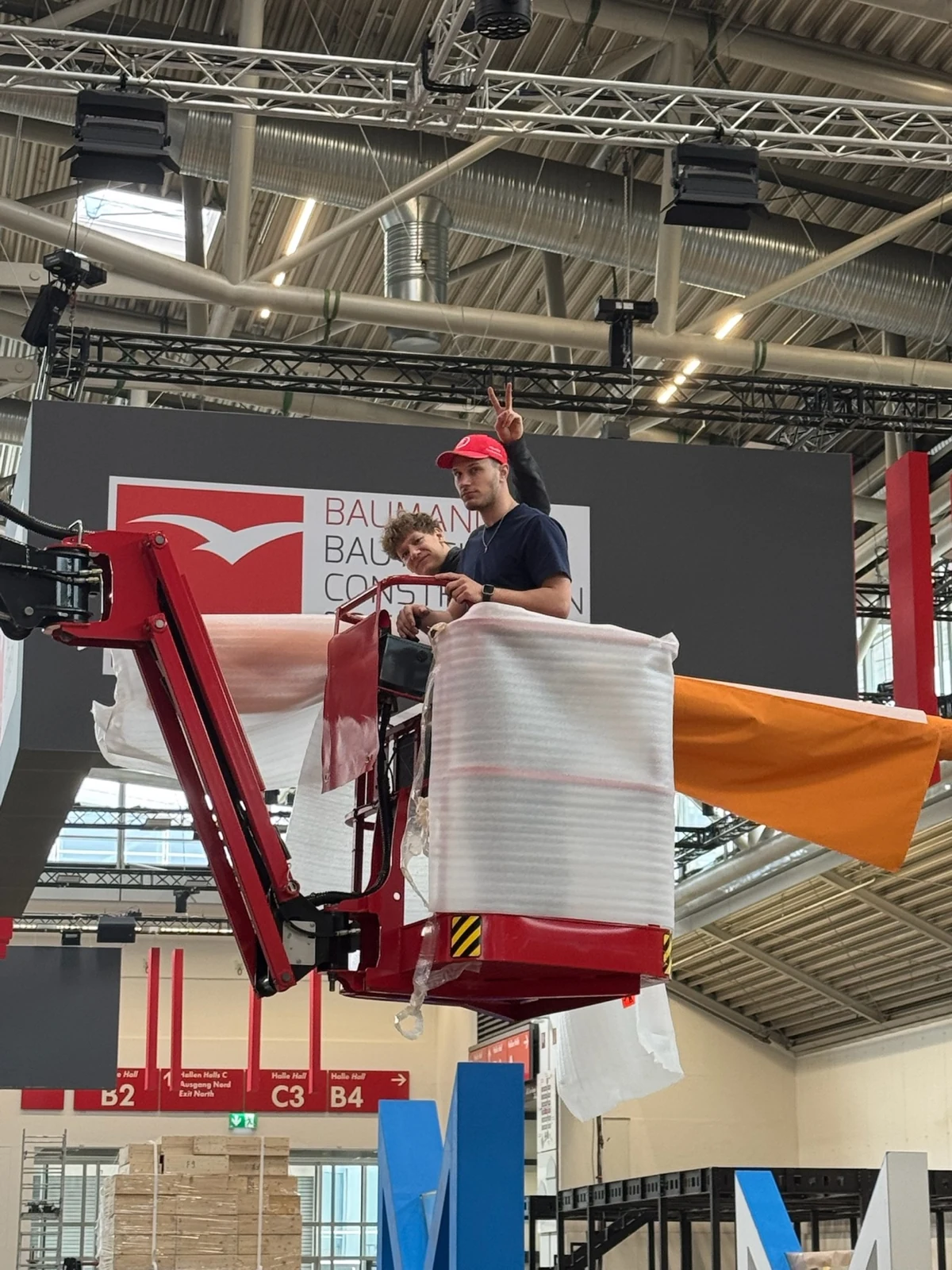 The material arrives by boom lift