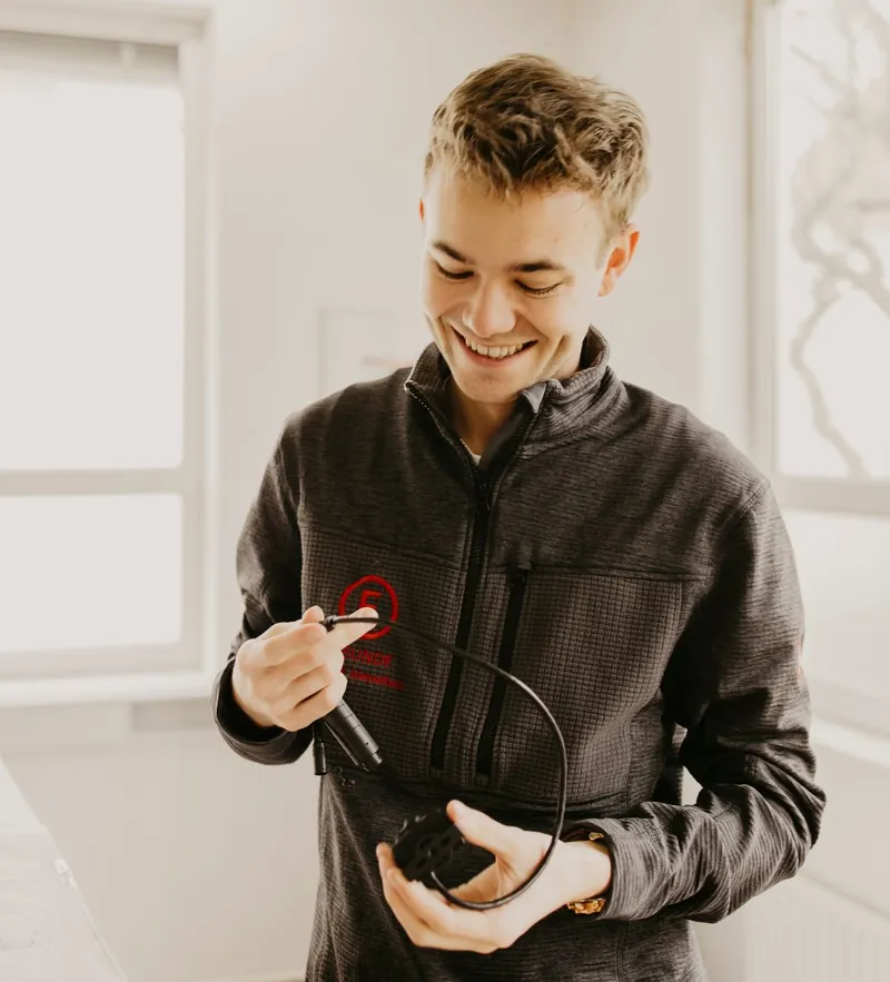 Erik Maier holding a VISPAL sensor with its cable